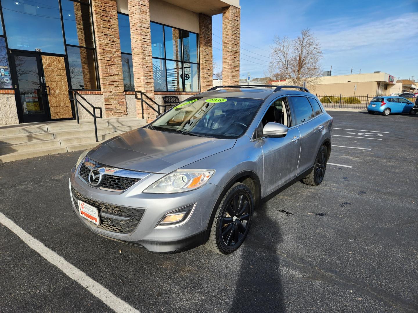 2010 Liquid Silver Metallic /Black Mazda CX-9 Grand Touring (JM3TB3MA6A0) with an 3.7L V6 DOHC 24V engine, Automatic transmission, located at 10890 W. Colfax Ave., Lakewood, CO, 80215, (303) 274-7692, 39.739914, -105.120132 - 2010 Mazda CX-9<br><br>D1 Auto NEVER charges dealer fees! All cars have clean titles and have been inspected for mechanical issues. We have financing for everyone. Good credit, bad credit, first time buyers.<br><br>Please call Lakewood Location 303-274-7692 or Thornton 303-287-5511 to schedule a tes - Photo#1